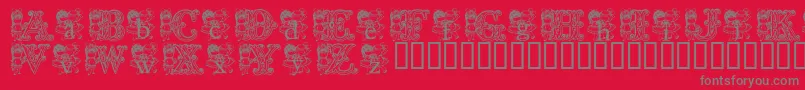 フォントKgCutie1 – 赤い背景に灰色の文字