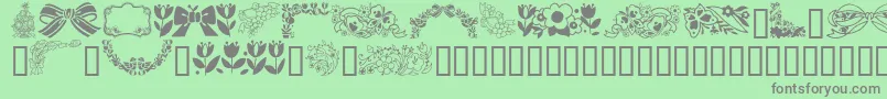 GeSpringtime Font – Gray Fonts on Green Background