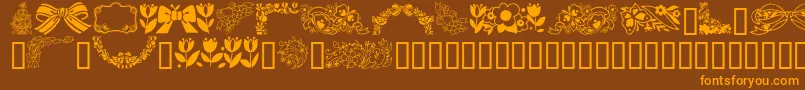 GeSpringtime-Schriftart – Orangefarbene Schriften auf braunem Hintergrund