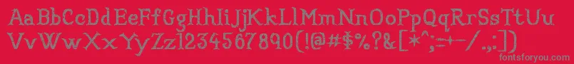 フォントConvincingpirate – 赤い背景に灰色の文字