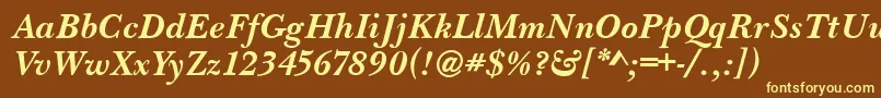 BaskervilleHandcutBolditalic-fontti – keltaiset fontit ruskealla taustalla