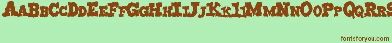 MonstruoJedagraphicx Font – Brown Fonts on Green Background