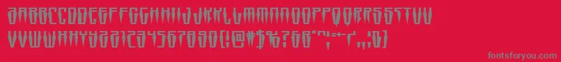 フォントSwordtoothexpand – 赤い背景に灰色の文字