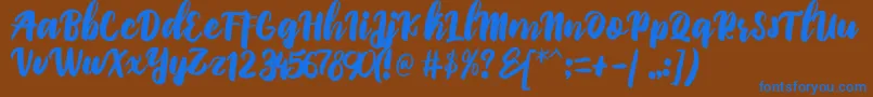 PriscilliaScript Font – Blue Fonts on Brown Background