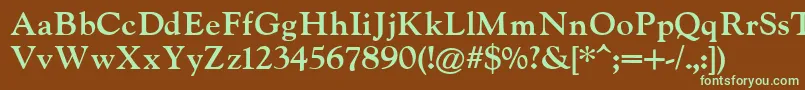 フォントIndiraK – 緑色の文字が茶色の背景にあります。