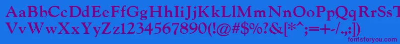 IndiraK Font – Purple Fonts on Blue Background