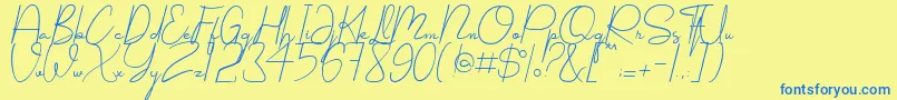 フォントShellomita – 青い文字が黄色の背景にあります。