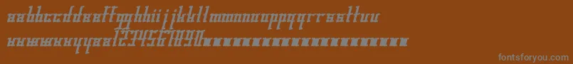 Gleesteak-fontti – harmaat kirjasimet ruskealla taustalla