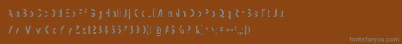 フォントMashySchizoid – 茶色の背景に灰色の文字