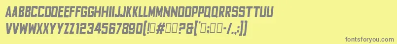 FyodorBoldcondensedoblique-fontti – harmaat kirjasimet keltaisella taustalla
