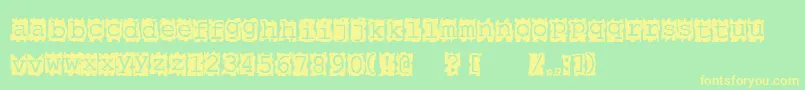 Papercut Font – Yellow Fonts on Green Background