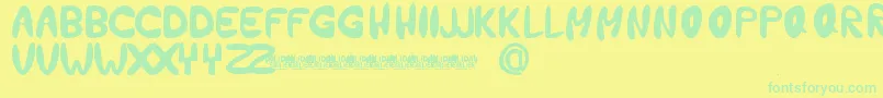 HolidayEarlierFontBySetitikasa Font – Green Fonts on Yellow Background
