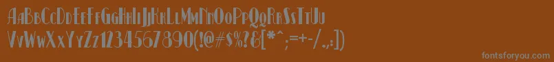 Kismetnf-fontti – harmaat kirjasimet ruskealla taustalla