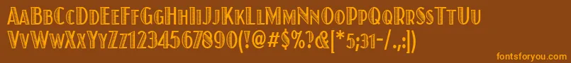 フォントJuanitaxiloitccdTt – オレンジ色の文字が茶色の背景にあります。