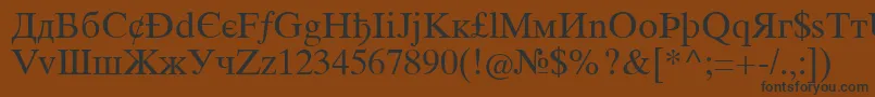 フォントIntouristiqua – 黒い文字が茶色の背景にあります