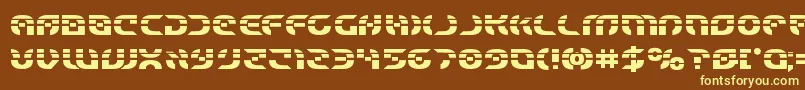 Starfighterlaserbold-fontti – keltaiset fontit ruskealla taustalla