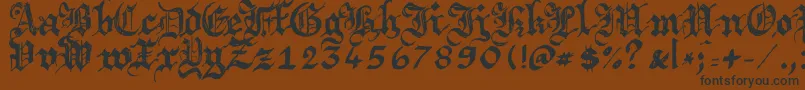 Argbrujs Font – Black Fonts on Brown Background
