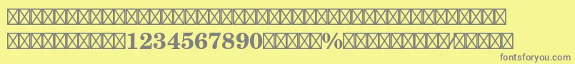 NewcenturyschlbkltstdFrabd-fontti – harmaat kirjasimet keltaisella taustalla