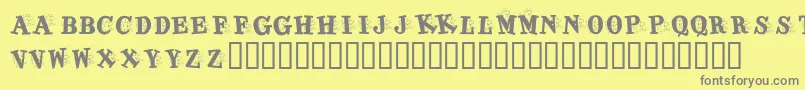 KrJigsawJoey-Schriftart – Graue Schriften auf gelbem Hintergrund
