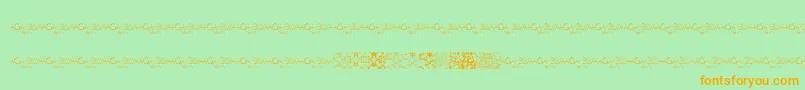 フォントMayaTilesPromo – オレンジの文字が緑の背景にあります。