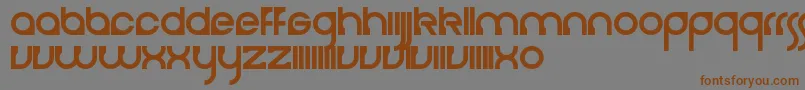 フォントCerebro – 茶色の文字が灰色の背景にあります。