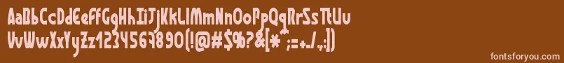 フォントGraphismeThin – 茶色の背景にピンクのフォント
