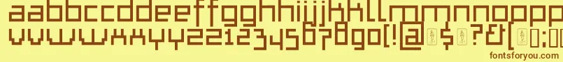フォントThapkieMg – 茶色の文字が黄色の背景にあります。