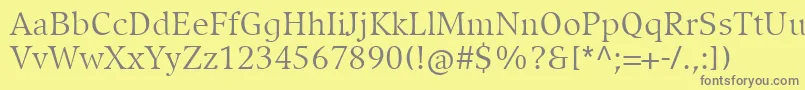 CompatilExquisitLtComRegular-Schriftart – Graue Schriften auf gelbem Hintergrund