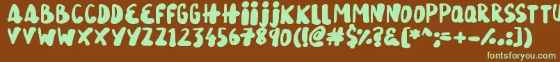 フォントSnowySkies – 緑色の文字が茶色の背景にあります。