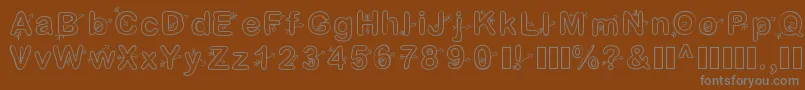 Cupidon-fontti – harmaat kirjasimet ruskealla taustalla