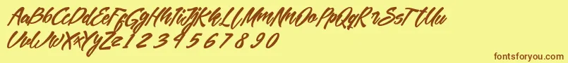 Fonte MekarScript – fontes marrons em um fundo amarelo