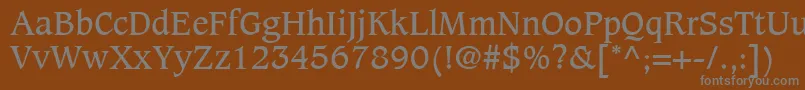 CaxtonLtBook-fontti – harmaat kirjasimet ruskealla taustalla