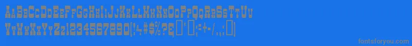 DryGoodsNarrowSm.CapsJl Font – Gray Fonts on Blue Background