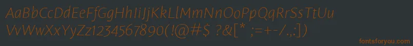 Шрифт LeksasansproExtralightItalic – коричневые шрифты на чёрном фоне