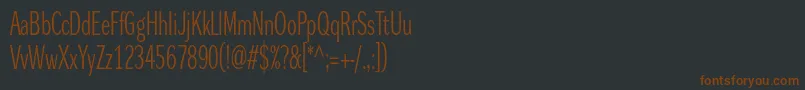 フォントDynagrotesklxc – 黒い背景に茶色のフォント
