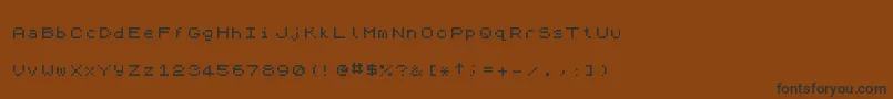 Czcionka ZxSpectrum7 – czarne czcionki na brązowym tle