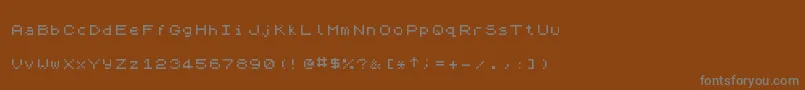 ZxSpectrum7 Font – Gray Fonts on Brown Background