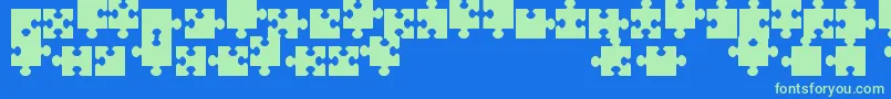 JigsawPiecesTfb-Schriftart – Grüne Schriften auf blauem Hintergrund