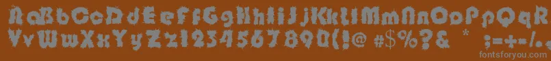 Shockfloyd-fontti – harmaat kirjasimet ruskealla taustalla