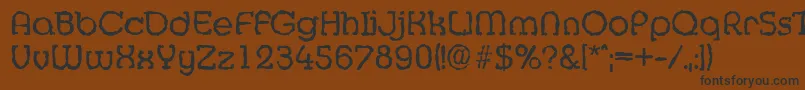 MexicorandomRegular Font – Black Fonts on Brown Background