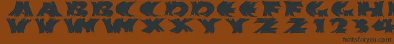 フォントHurrikanish – 黒い文字が茶色の背景にあります