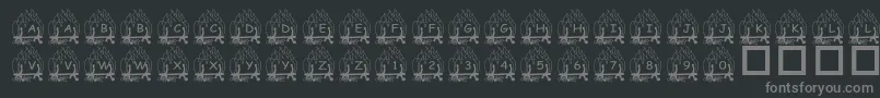 PfYulefire1-fontti – harmaat kirjasimet mustalla taustalla