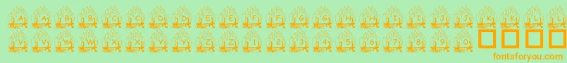 PfYulefire1-Schriftart – Orangefarbene Schriften auf grünem Hintergrund