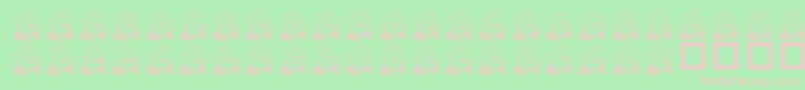 PfYulefire1-fontti – vaaleanpunaiset fontit vihreällä taustalla