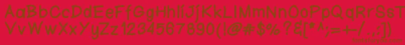 Fonte Ktnfingerwriting – fontes marrons em um fundo vermelho
