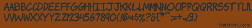Komikj-Schriftart – Schwarze Schriften auf braunem Hintergrund