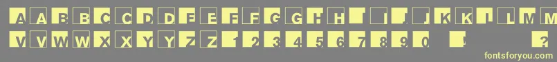 Abclogosxyz-Schriftart – Gelbe Schriften auf grauem Hintergrund