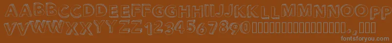 Pwperspective-fontti – harmaat kirjasimet ruskealla taustalla