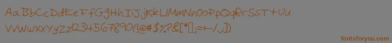 フォントMichaelfont – 茶色の文字が灰色の背景にあります。