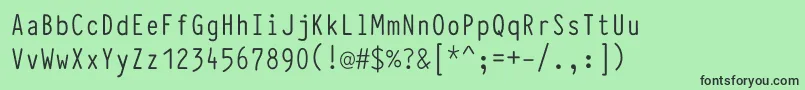 TypewcondRegular-fontti – mustat fontit vihreällä taustalla